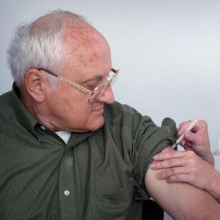 Getting a Flu Vaccination for older people who are advised to shield.