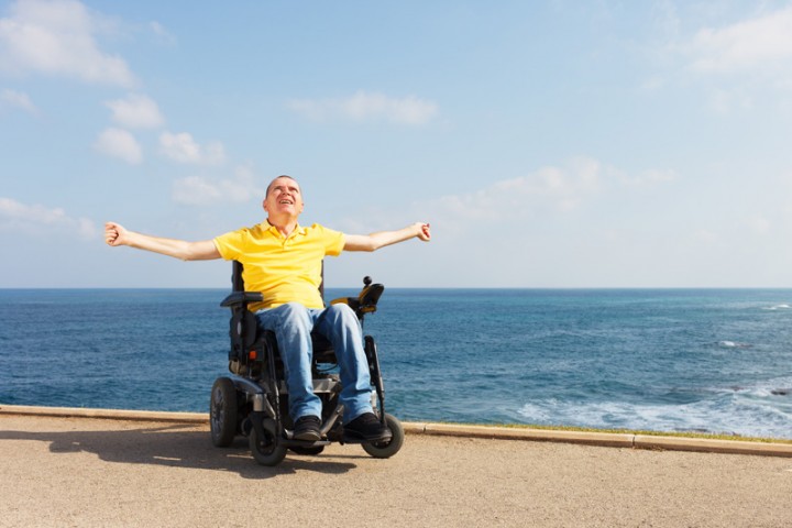 Disabled man on holiday with his holiday companion