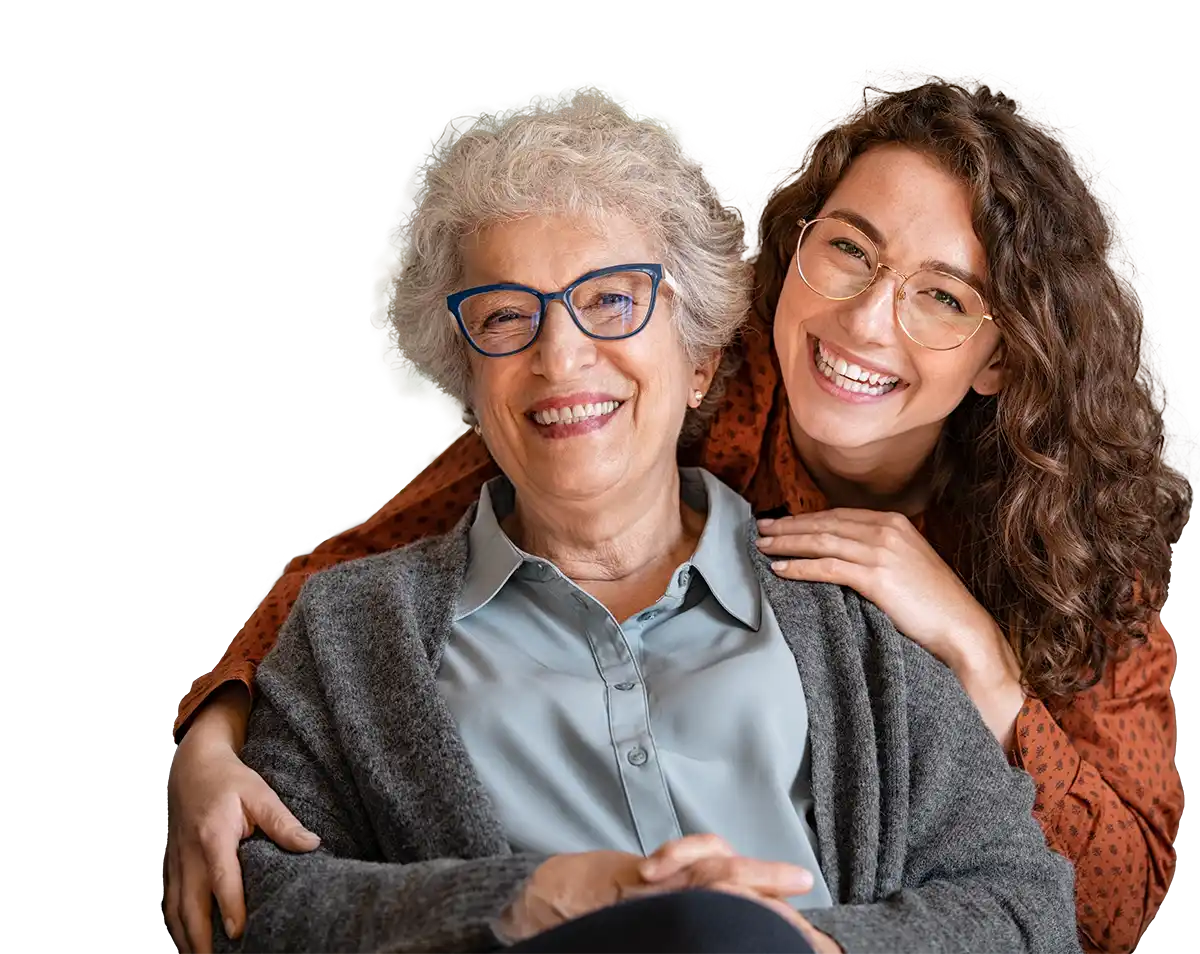 Live-in Care client and carer smiling.