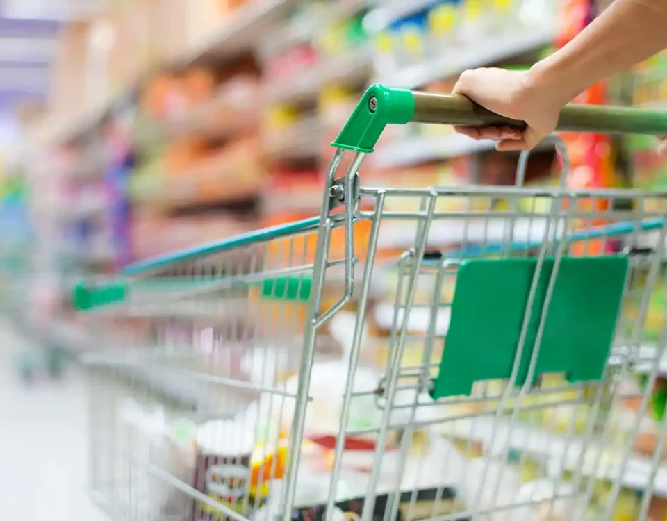 Person pushing a supermarket shopping trolley during quiet hours